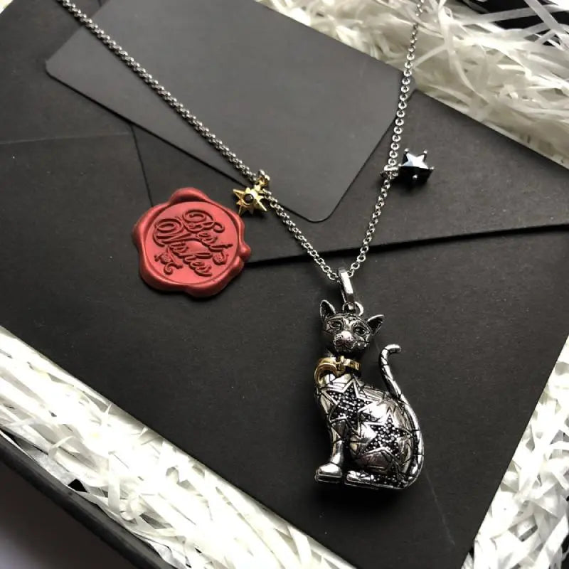 pendentif chat assis avec étoiles - Vraiment-chat
